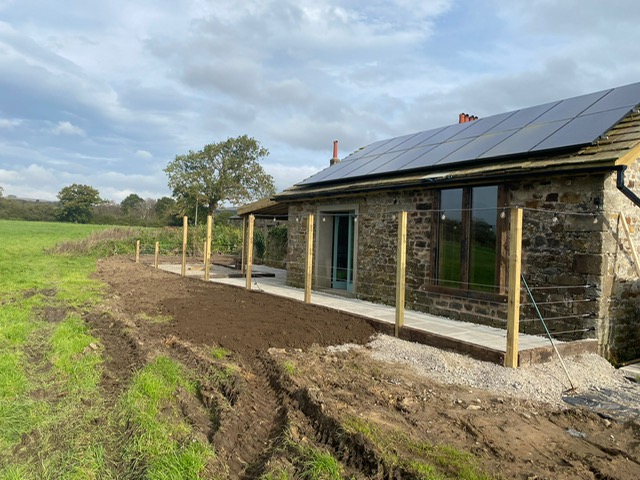 Image of area renovated and installation of log burner Hot Tub.